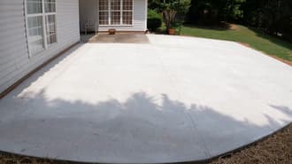 Fresh concrete patio in backyard of home in Oakland, CA.