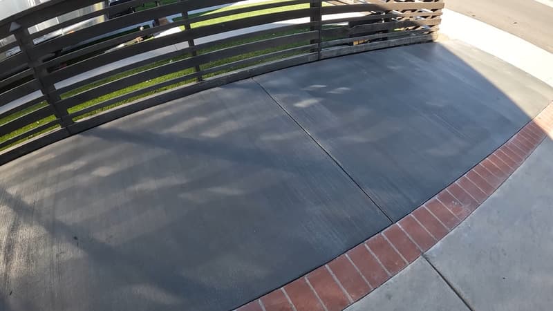 Driveway with a new concrete extension on the side.