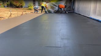 Crew finishing concrete patio in Oakland, CA.