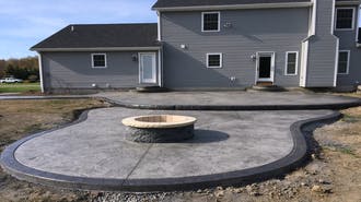 Stamped concrete for new patio with fire pit.